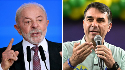 Flávio Bolsonaro y Lula da Silva saludan en el debate presidencial
